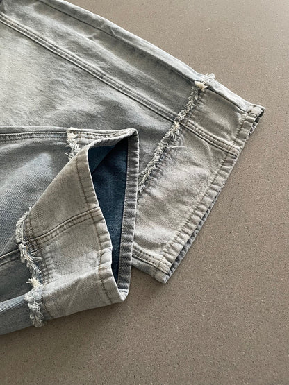 // 設計感假反褶毛邊洗水牛仔闊褲